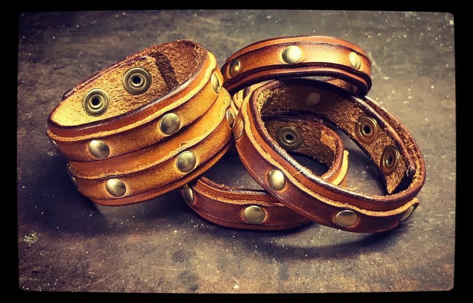 Brown leather bracelets with brass rivets
